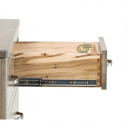 Chest of drawers top interior view with slide rails, light wood panel, and metal latch