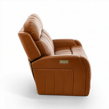 Tan leather home theater sofa with padded arm and chaise-style seat