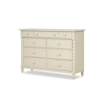 Cream dresser with six drawers and round knobs, raised on turned legs