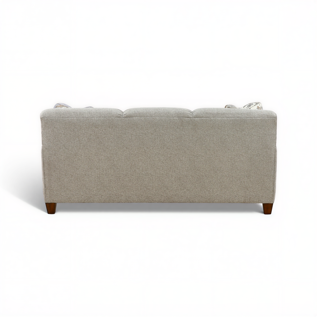 Beige upholstered sofa with visible back cushions and dark wood legs