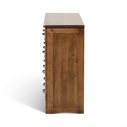 Wood dresser side view with panel front and dark knob hardware