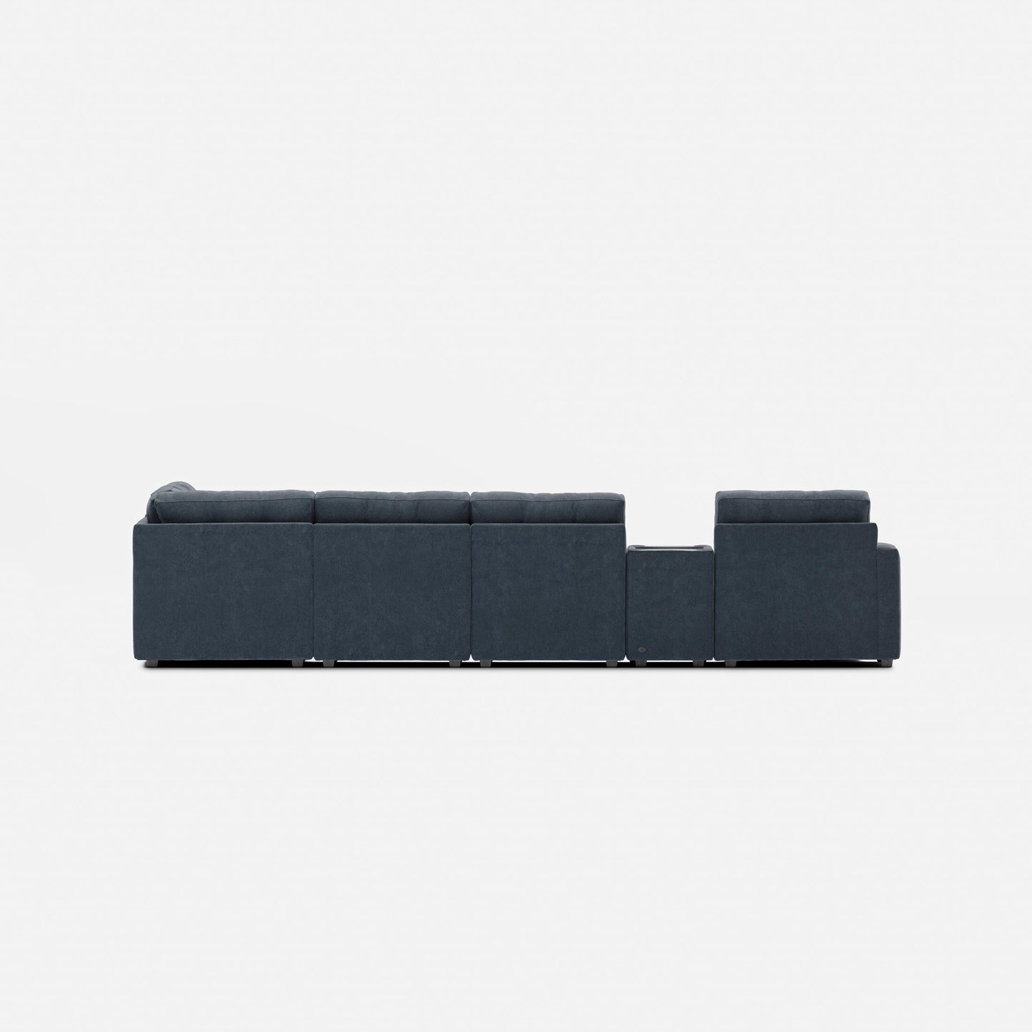Dark blue modular sectional sofa with long straight back and ottoman-style end modules