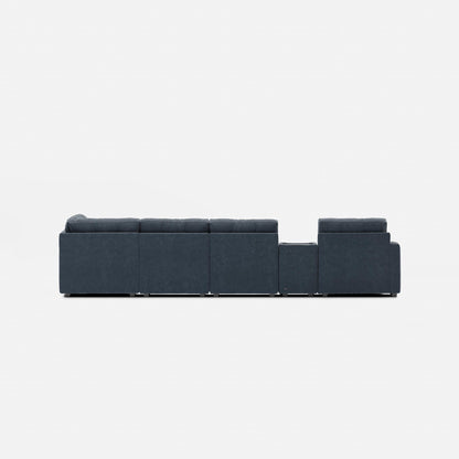 Dark blue modular sectional sofa with long straight back and ottoman-style end modules