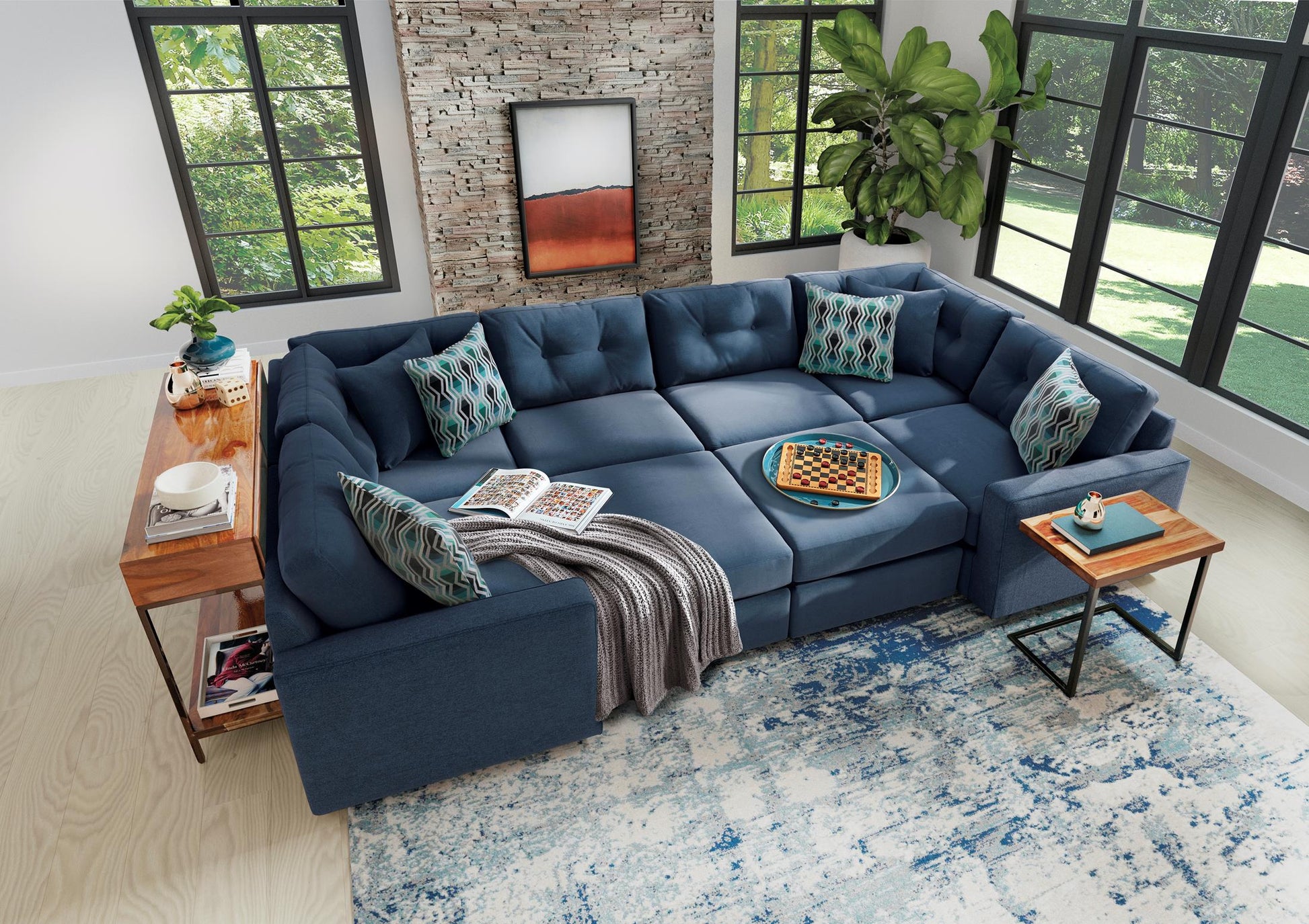 Dark blue 6-piece modular sectional sofa with chaise corner and patterned throw pillows