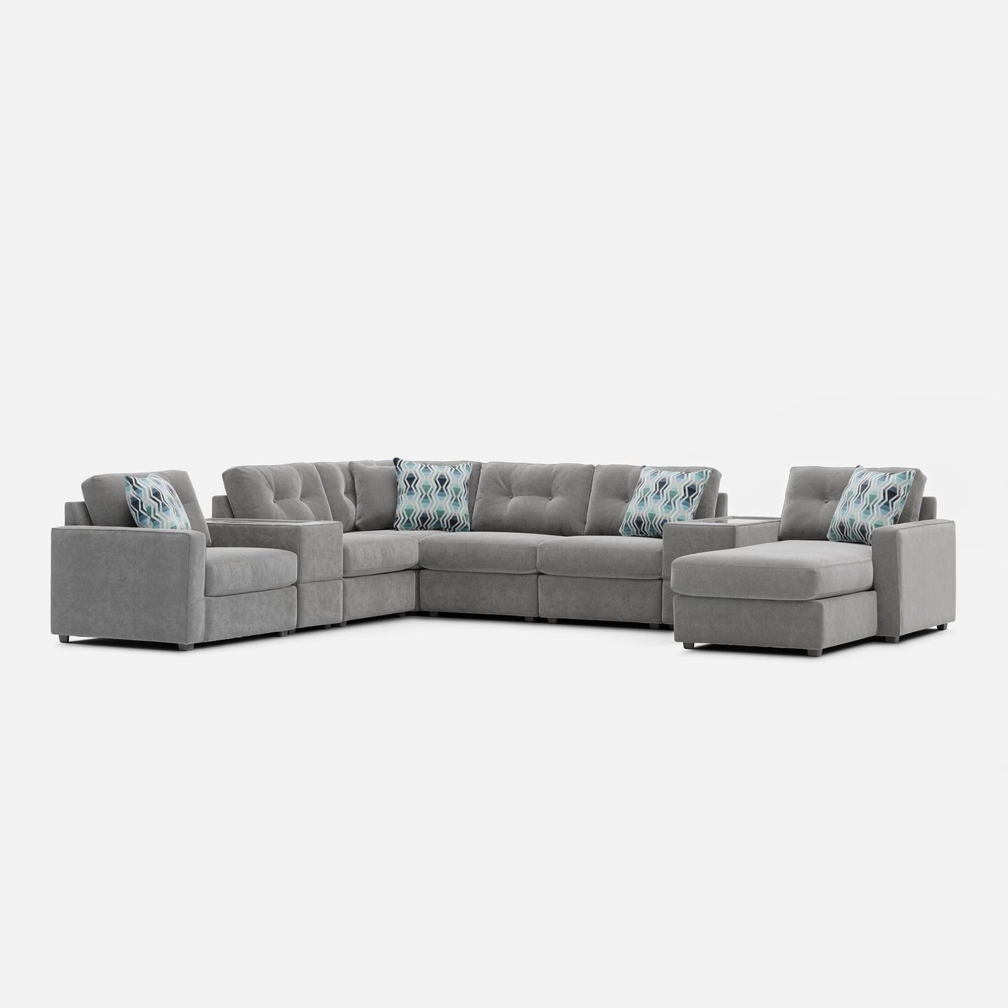 Gray modular sectional sofa with patterned lumbar pillows and chaise end seating