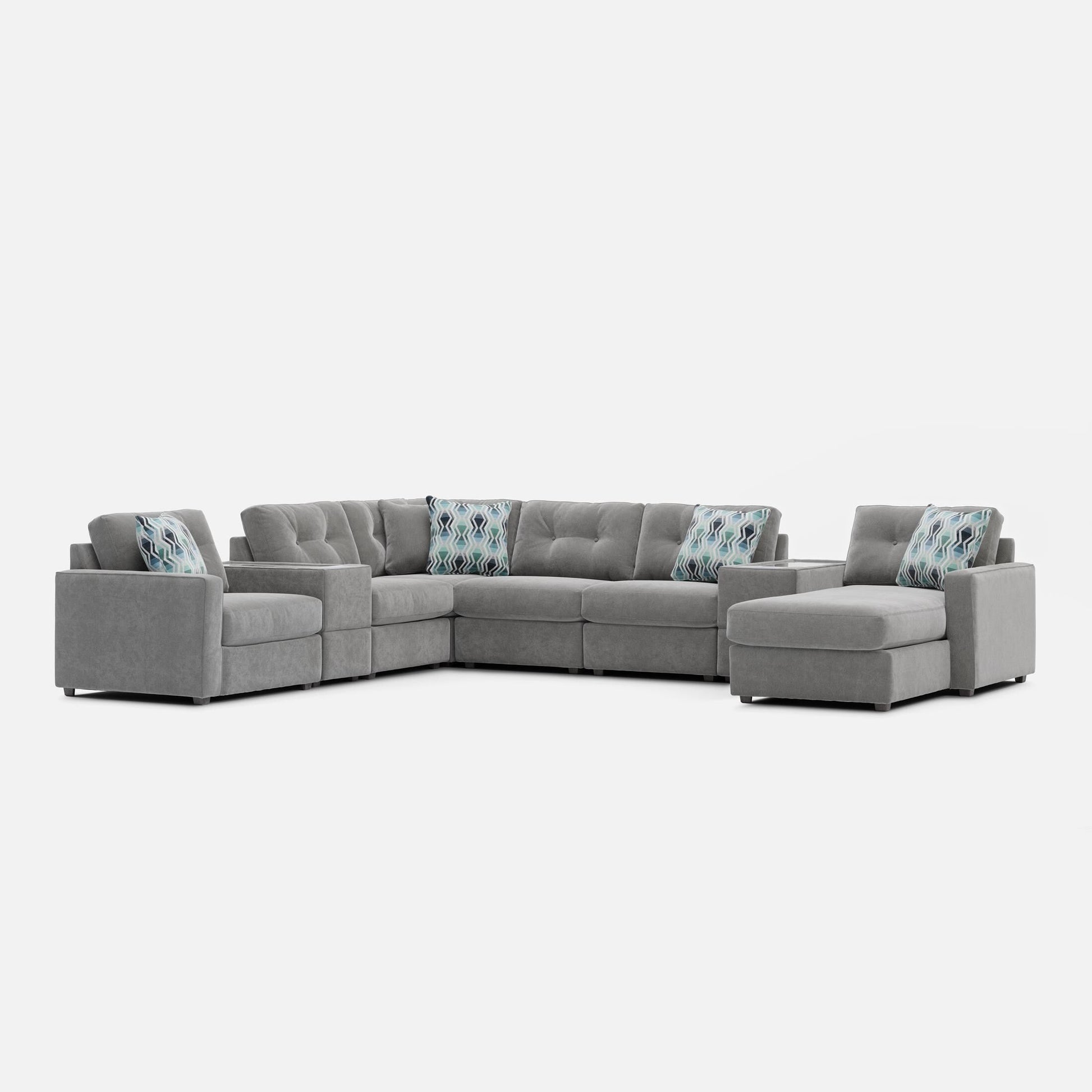 Gray modular sectional sofa with patterned lumbar pillows and chaise end seating