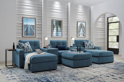 Teal theater sectional sofa with dual chaise, tufted cushions, and rounded seat blocks.