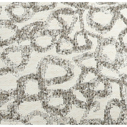 Close-up of woven light-beige and dark patterned fabric for accent pillow cover