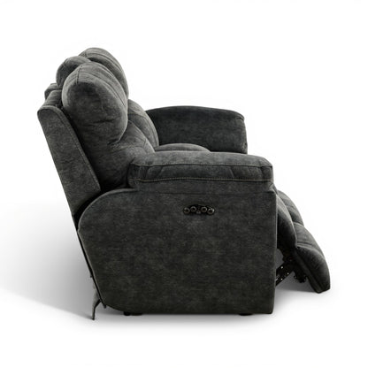 Dark gray power recliner loveseat with padded arms and center console buttons