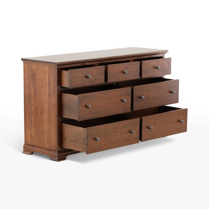 Brown wooden dresser with drawers pulled open and metal knobs, angled view