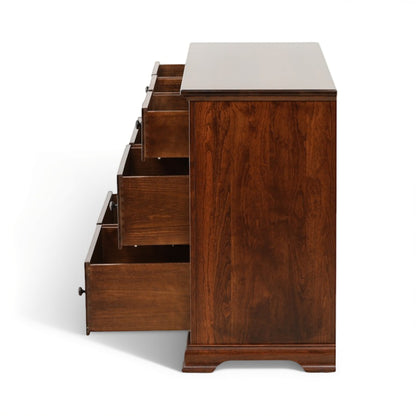 Brown wooden dresser corner with multiple drawers pulled out, side view