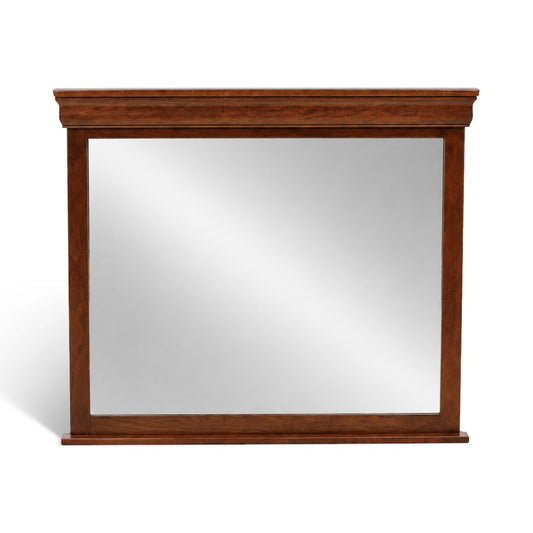 Beveled bedroom mirror with dark wood frame and rectangular glass