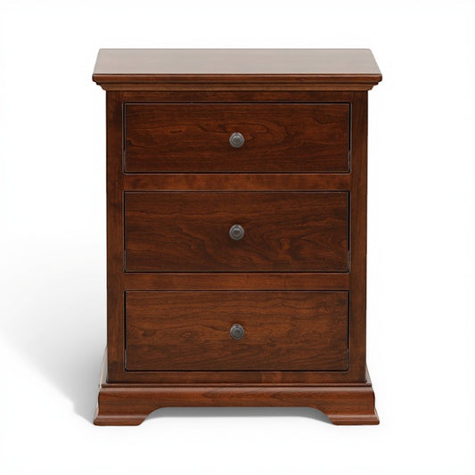 Brown wood nightstand with three drawers and round metal knobs, closed front view
