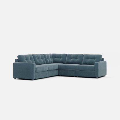 Teal modular sectional sofa with tufted upholstery and clean-lined arms.