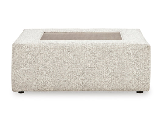 Light beige upholstered ottoman with rectangular opening and short legs