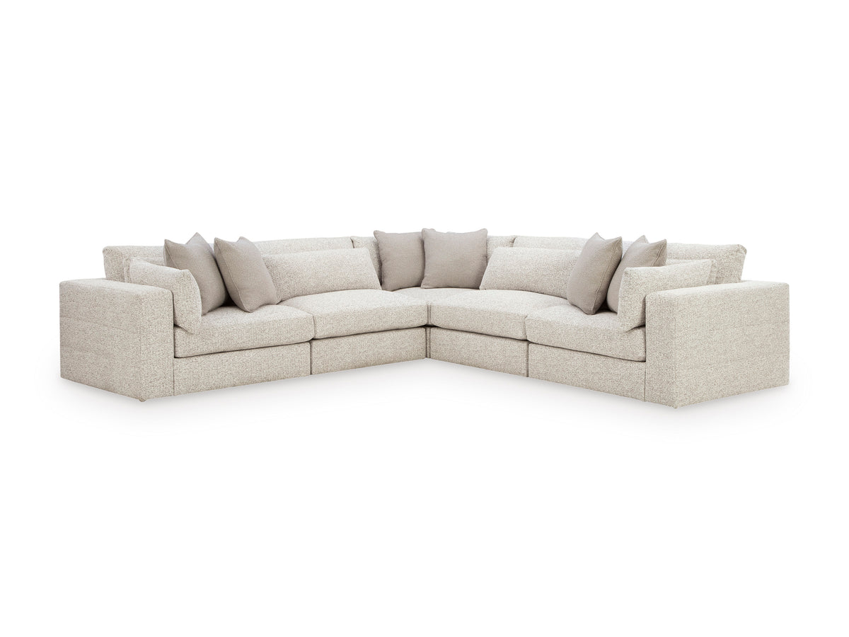 Light gray L-shaped modular sectional sofa with corner section and back pillows