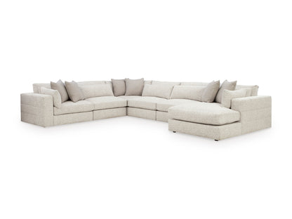 Light beige sectional with chaise module and tufted back cushions, low profile