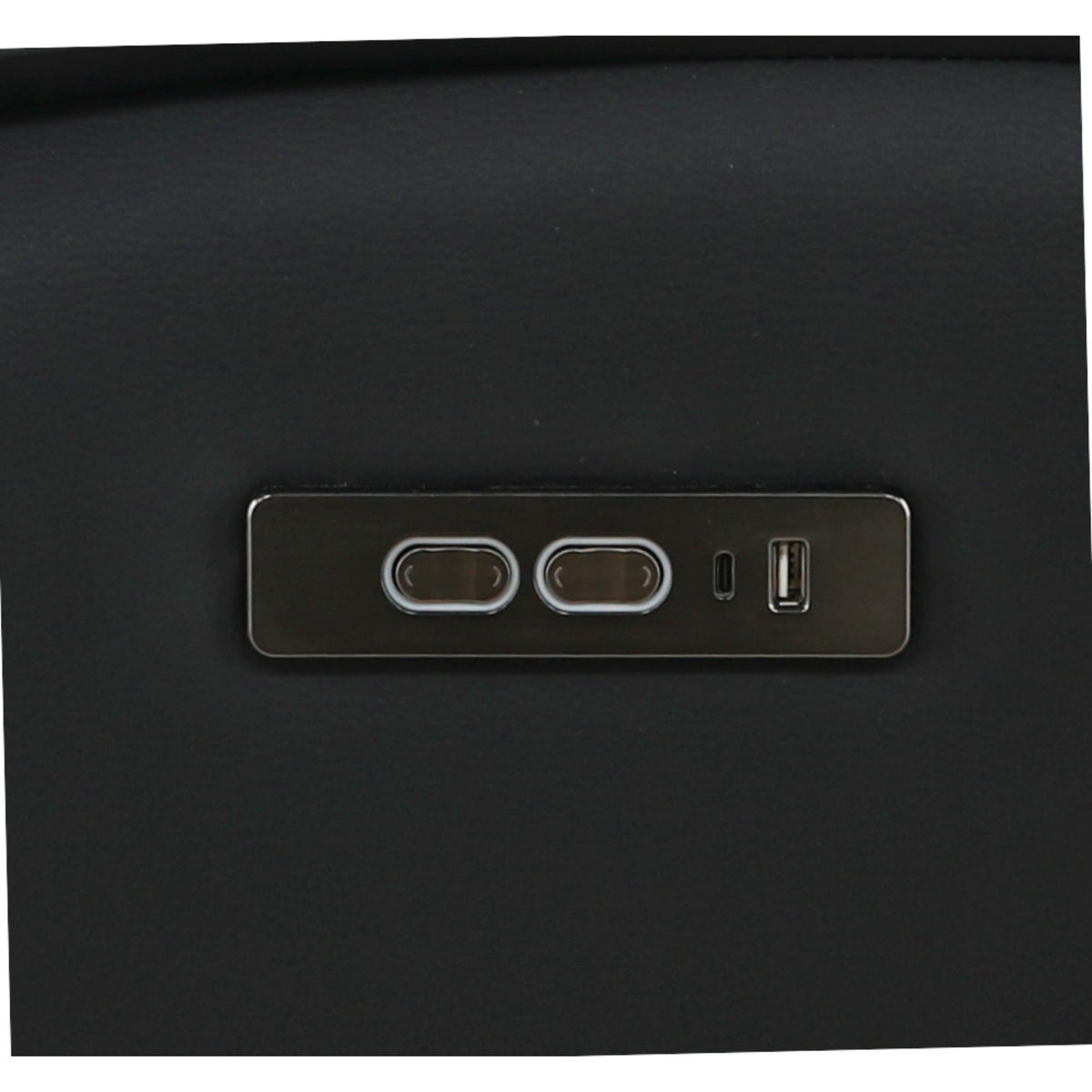 Close-up of side control panel with ports and small buttons on black leather.