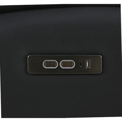 Close-up of side control panel with ports and small buttons on black leather.