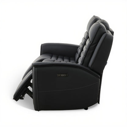 Power reclining sofa chair with dark leather look and padded armrest, side view