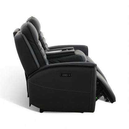 Black power reclining sofa chair in reclined position with side leg rest extended