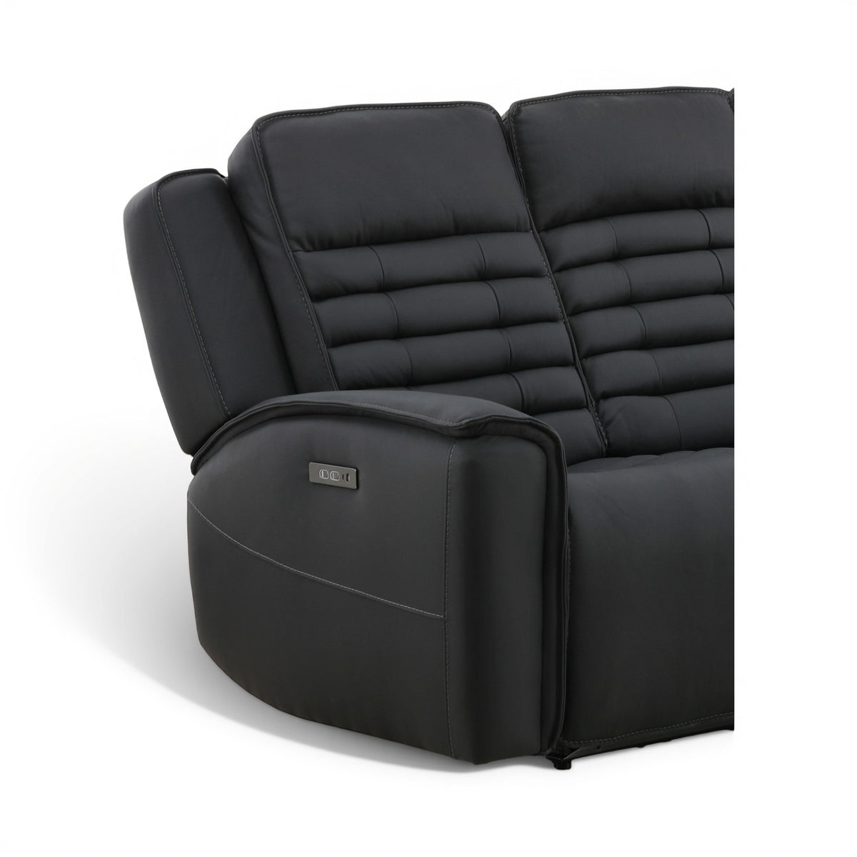 Black leather power reclining sofa close-up of armrest control panel and quilted back stitching.