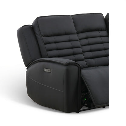 Black leather power reclining sofa close-up of armrest and recline mechanism with indicator light.