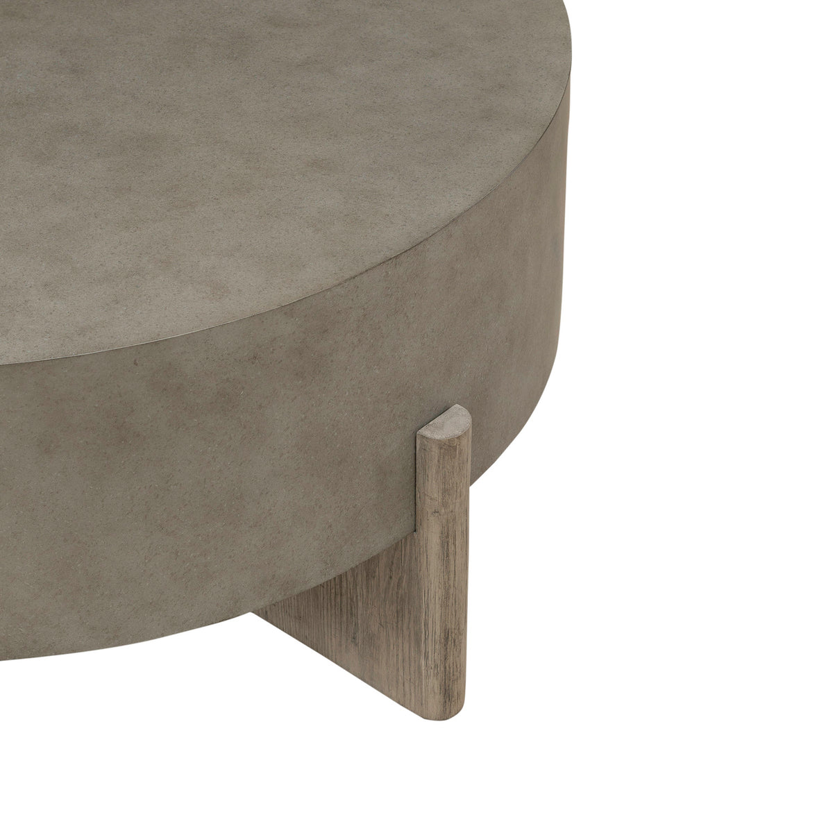 Corner detail of round gray coffee table with wooden leg and open frame