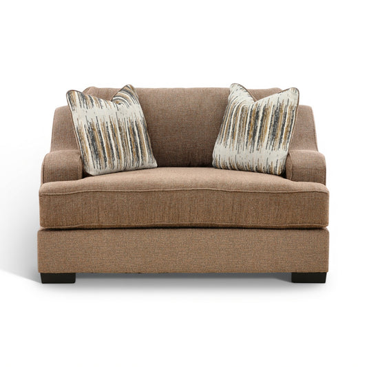 Two-cushion accent chair in brown fabric with two vertical-stripe throw pillows