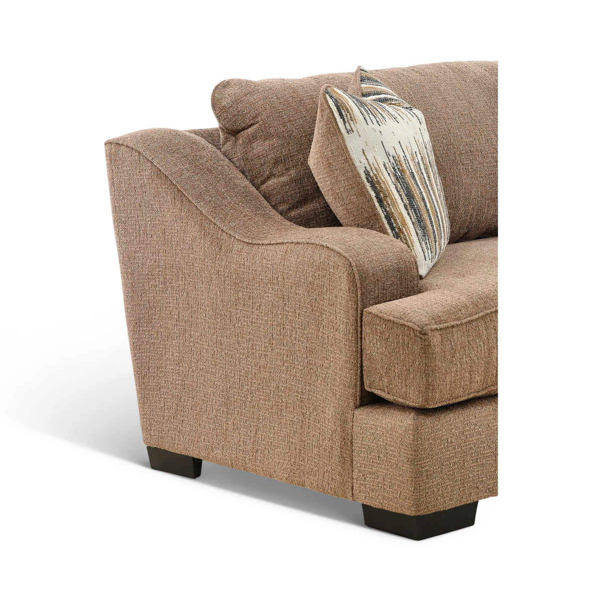 Corner view of brown accent chair with curved arms and one striped throw pillow
