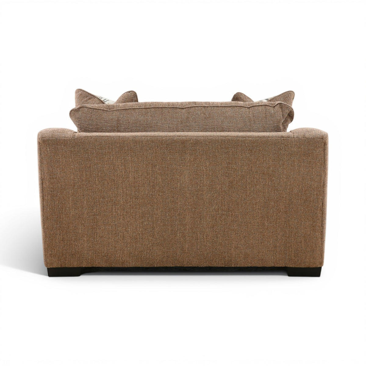 Back view of brown upholstered chair with two folded arms and striped accent pillows