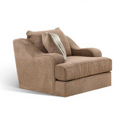 Taupe upholstered swivel chair with corner profile and striped accent pillow