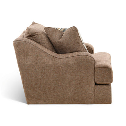 Taupe fabric swivel chair with wide seat, back cushions, and striped throw pillow