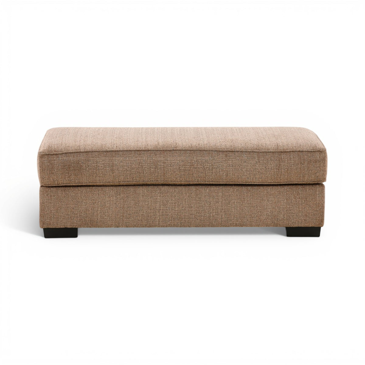 Tan fabric ottoman with padded top and black legs, rectangular storage-free design.