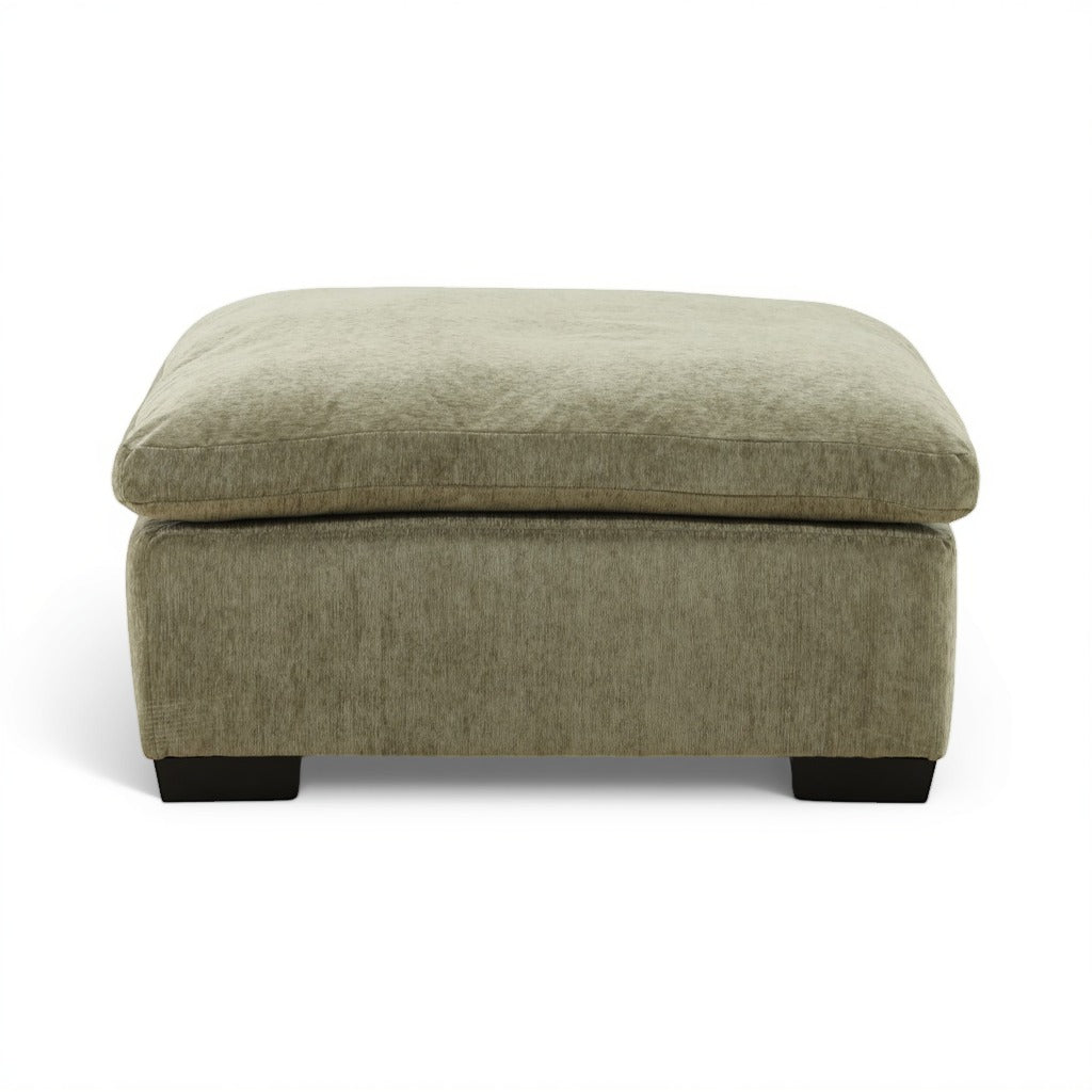 Light green ottoman with rounded top, smooth upholstery, and black block feet