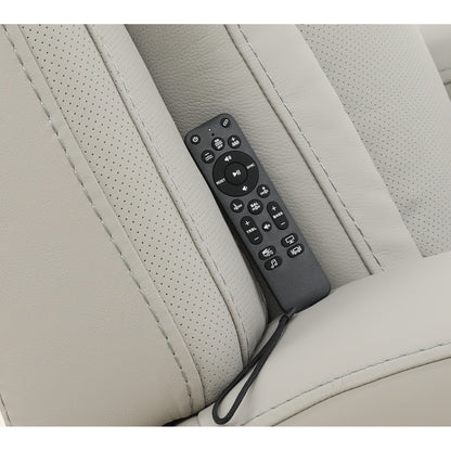 Leather power recliner remote control on light upholstery armrest