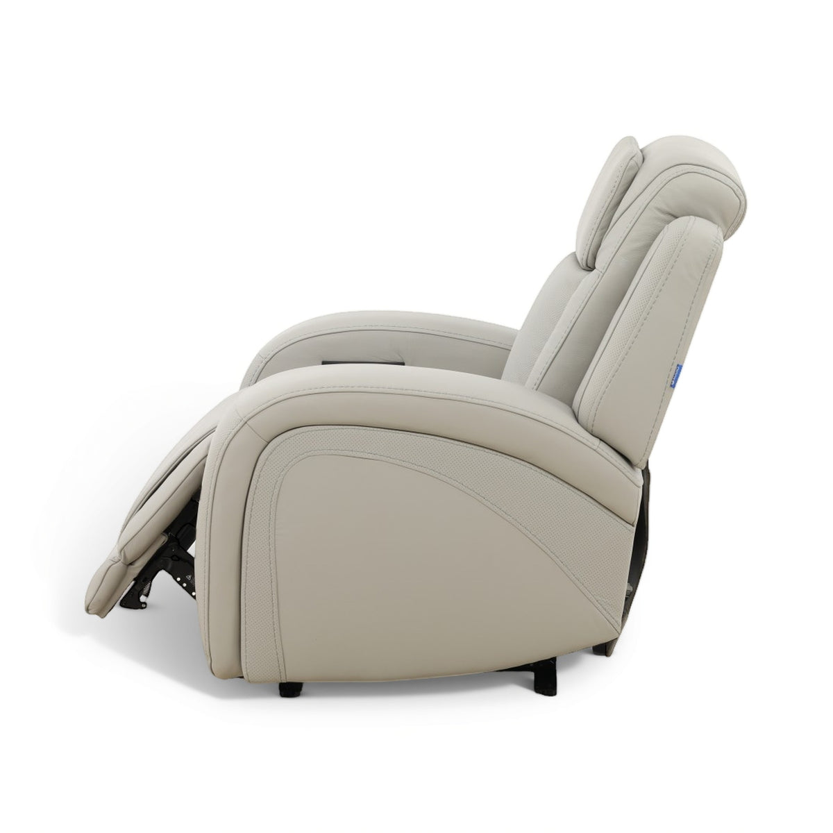 Beige power recliner chair reclined side angle with curved back and padded armrest