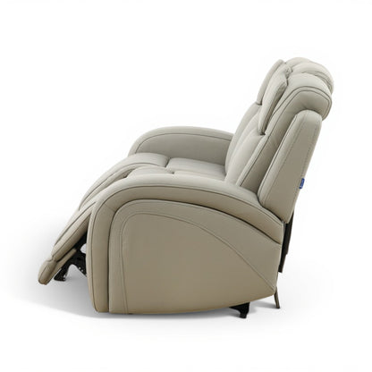 Light beige leather power reclining sofa side view with reclined backrest