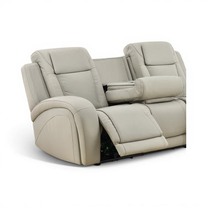Light beige leather power reclining sofa with padded arm and recline tray area