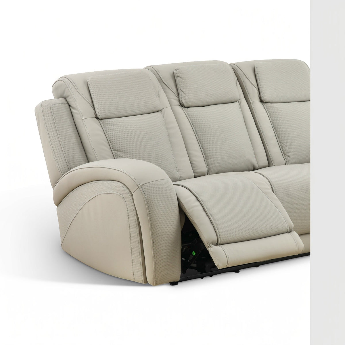 Beige leather power reclining sofa with tufted backrest and extended legrest
