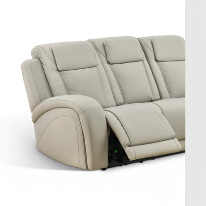 Beige leather power reclining sofa with tufted backrest and extended legrest