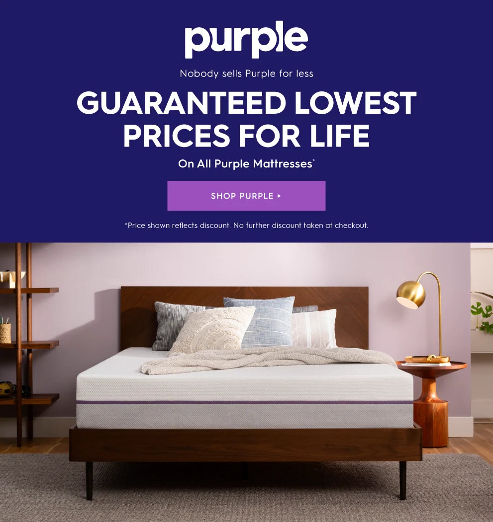 A wooden bed frame with a white mattress and pillows in a styled bedroom setting, next to a purple promotional banner for Purple Mattresses. Purple. Nobody sells Purple for less. Guaranteed lowest prices for life on all Purple mattresses*. Shop Purple. * Price shown reflects discount. No further discount taken at checkout.