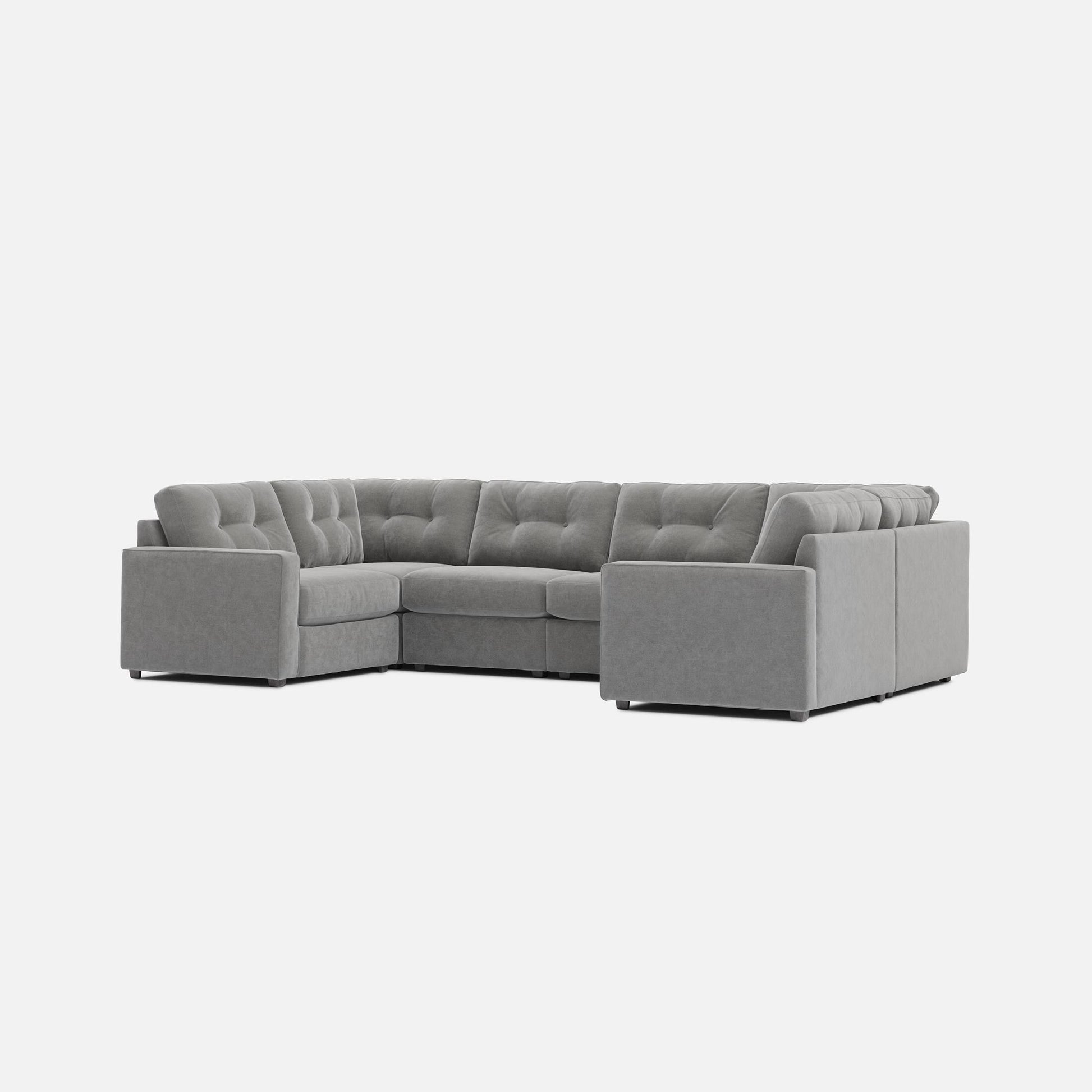 Light gray 6-piece modular sectional sofa with tufted seat and back cushions
