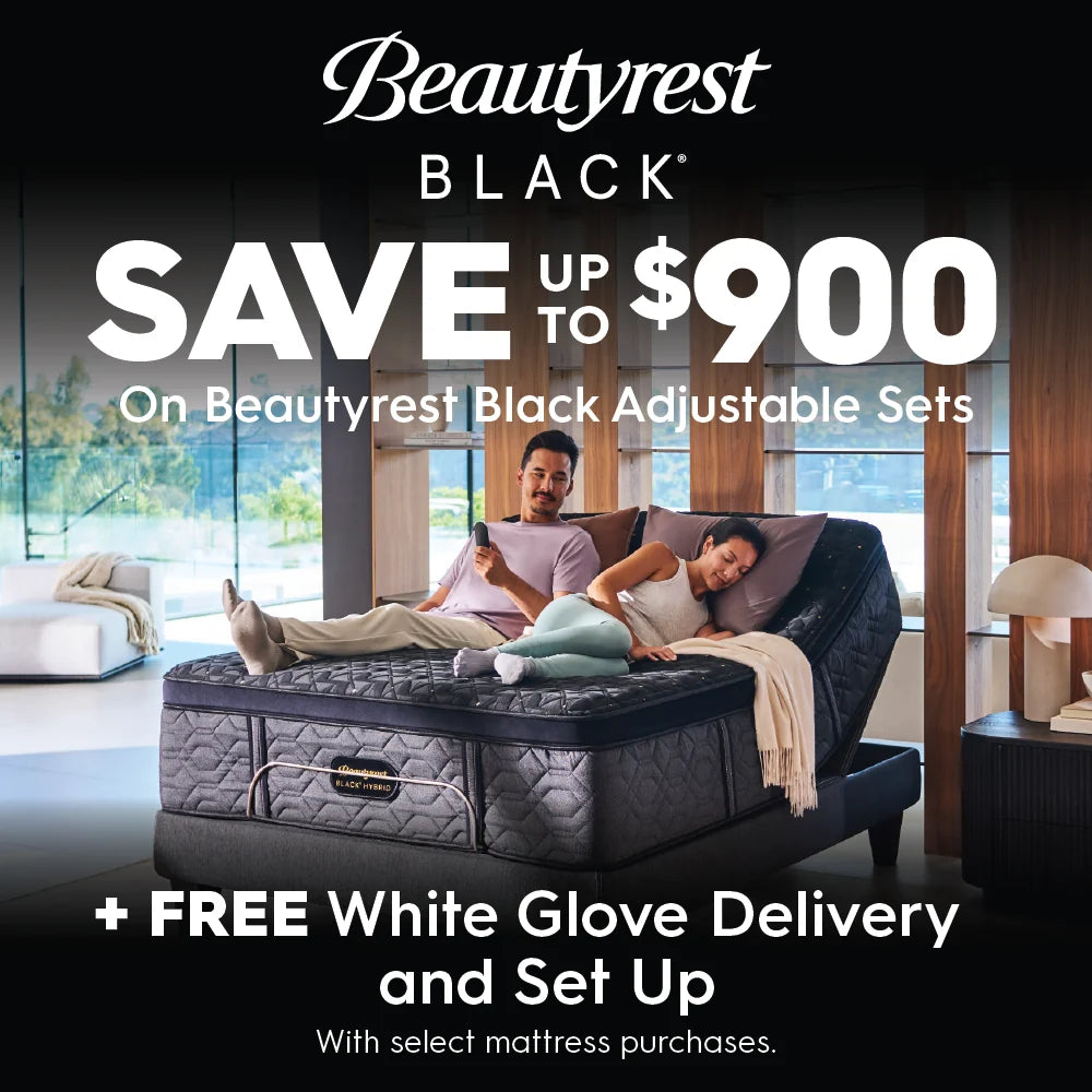 Advertisement for Beautyrest Black adjustable sets with a couple on the mattress in a bedroom setting. Save up to $900 on Beautyrest Black adjustable sets plus get free white glove delivery and set up with select mattress purchases.