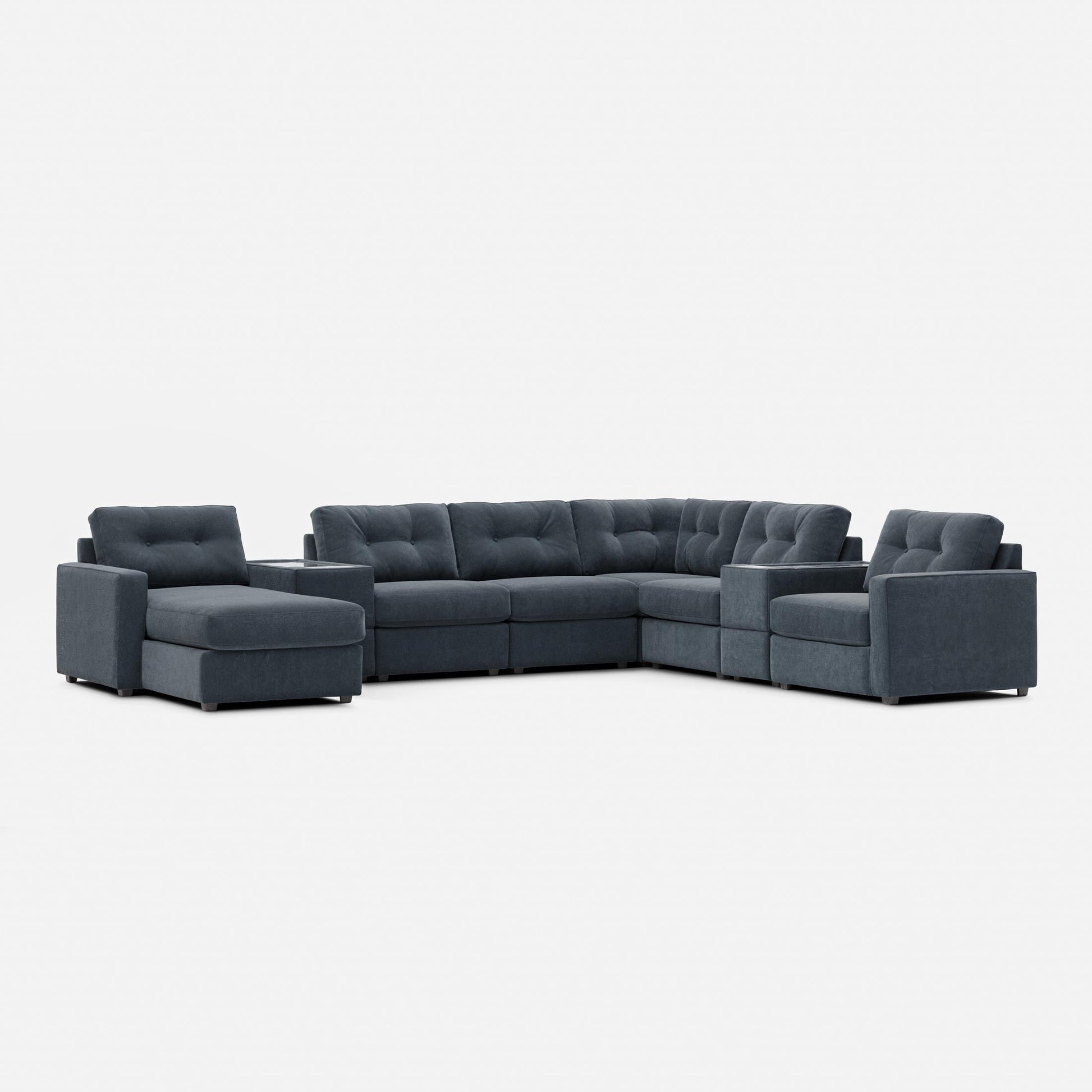 Dark gray modular sectional sofa with tufted back and chaise corner