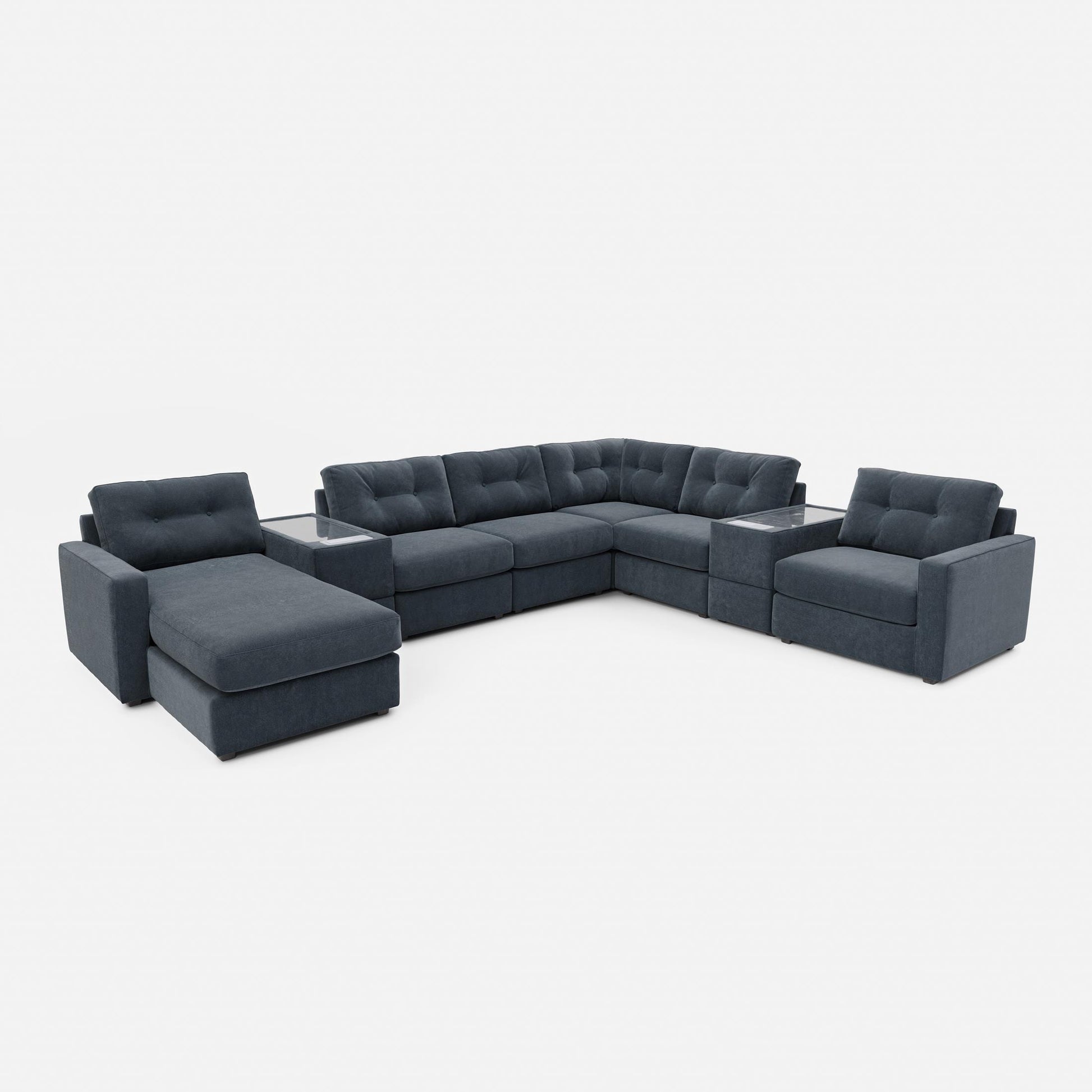 Dark blue modular sectional sofa with chaise-style corner and tufted back cushions