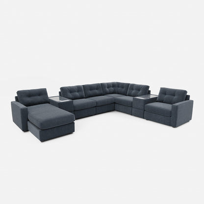 Dark blue modular sectional sofa with chaise-style corner and tufted back cushions