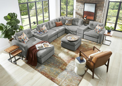 Gray modular sectional sofa with decorative patterned throw pillows