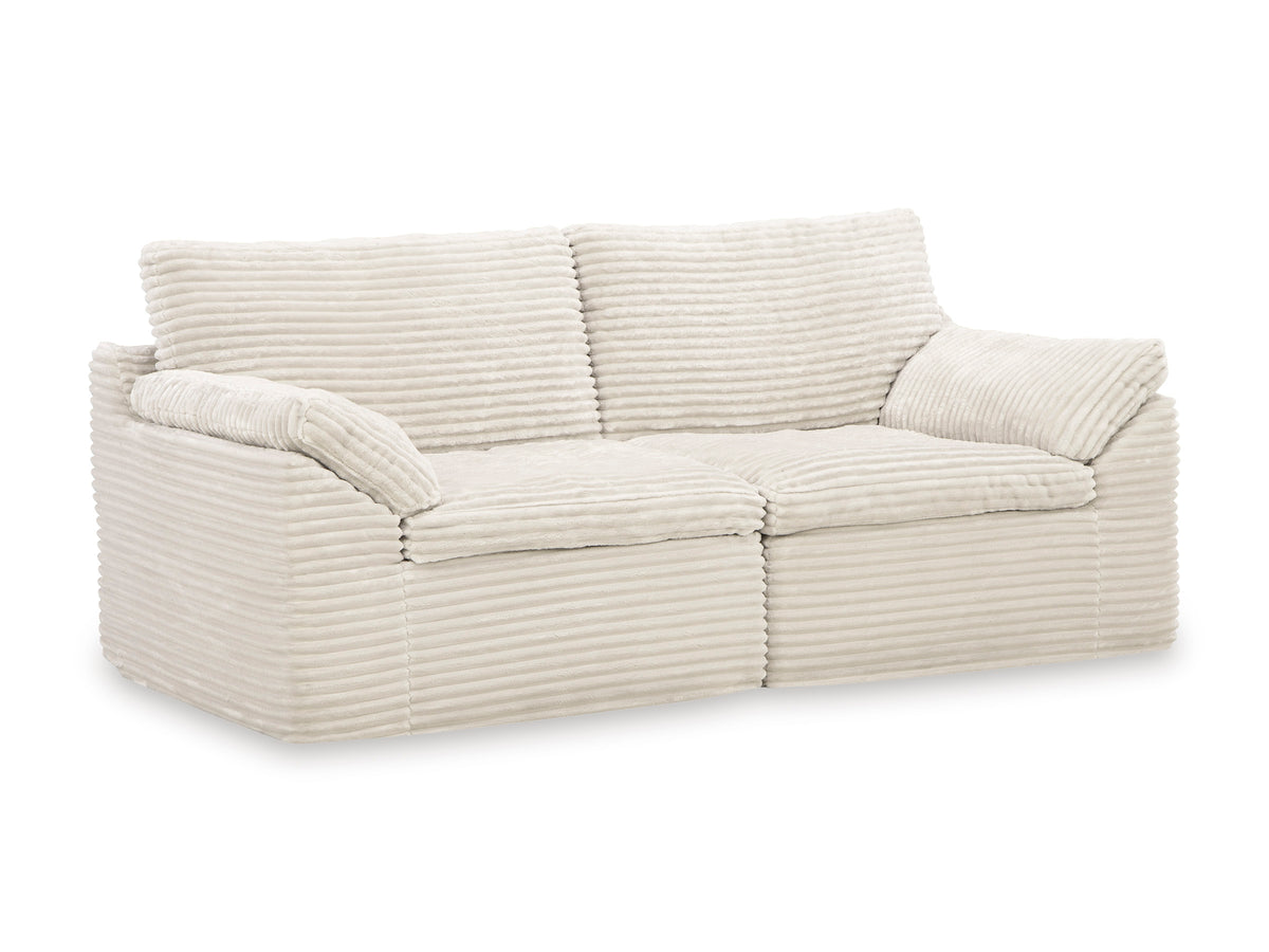 Cream striped loveseat with tufted back cushions and rolled arms
