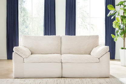 Cream striped 2-seat loveseat with rolled arms and two back cushions
